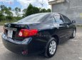 Toyota Corolla 1.8MT 2009 - Bán Toyota Corolla 1.8MT đời 2009, màu đen còn mới