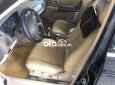 Ford Laser    2005 - Bán xe Ford Laser năm 2005, màu đen, xe nhập còn mới, 130tr