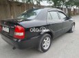 Mazda 323 2004 - Cần bán lại xe Mazda 323 sản xuất năm 2004, màu đen, giá 150tr