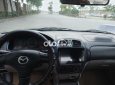 Mazda 323 2004 - Cần bán lại xe Mazda 323 sản xuất năm 2004, màu đen, giá 150tr