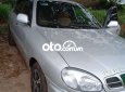 Daewoo Lanos MT 2003 - Cần bán gấp Daewoo Lanos MT sản xuất 2003, màu bạc, nhập khẩu