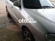 Daewoo Lanos MT 2003 - Cần bán gấp Daewoo Lanos MT sản xuất 2003, màu bạc, nhập khẩu