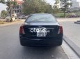 Daewoo Lacetti   EX 2010 - Cần bán Daewoo Lacetti EX sản xuất năm 2010, màu đen số sàn, giá 150tr