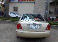 Ford Laser    MT 2002 - Cần bán Ford Laser MT năm 2002, màu vàng, giá chỉ 115 triệu