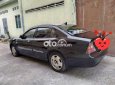 Daewoo Magnus 2004 - Cần bán lại xe Daewoo Magnus năm 2004, màu đen, giá 180tr