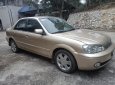 Ford Laser 2002 - Bán Ford Laser sản xuất 2002, màu vàng cát