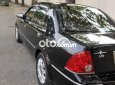 Ford Laser  GHIAAT 2004 - Bán ô tô Ford Laser GHIAAT sản xuất năm 2004, màu đen xe gia đình, giá 165tr