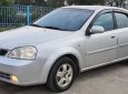 Daewoo Lacetti MT 2005 - Cần bán gấp Daewoo Lacetti MT năm 2005, màu bạc xe gia đình