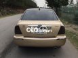 Ford Laser    MT 2002 - Bán Ford Laser MT năm 2002, màu vàng