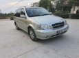 Kia Carnival GS 2009 - Cần bán lại xe Kia Carnival GS sản xuất năm 2009, màu bạc