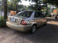 Ford Laser MT 2002 - Cần bán xe Ford Laser MT năm 2002, màu nâu