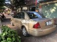 Ford Laser MT 2002 - Cần bán xe Ford Laser MT năm 2002, màu nâu