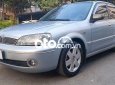 Ford Laser   Ghia 1.8 MT 2002 - Cần bán xe Ford Laser Ghia 1.8 MT sản xuất năm 2002, màu bạc 