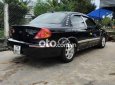 Kia Spectra   2004 - Cần bán gấp Kia Spectra năm 2004, màu đen, nhập khẩu 