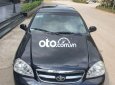 Daewoo Lacetti EX 2009 - Cần bán Daewoo Lacetti EX năm 2009, màu đen xe gia đình