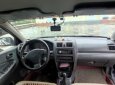 Mazda 323 2000 - Bán Mazda 323 năm 2000, màu đen số sàn