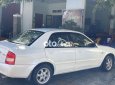 Mazda 323 2.0MT 2003 - Bán Mazda 323 2.0MT năm sản xuất 2003, màu trắng, nhập khẩu nguyên chiếc, giá 119tr