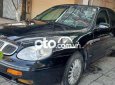 Daewoo Leganza 2002 - Cần bán gấp Daewoo Leganza sản xuất năm 2002, màu đen, xe nhập, 87tr