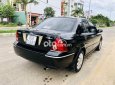 Ford Laser 2004 - Bán ô tô Ford Laser sản xuất 2004, màu đen, 157 triệu