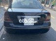 Ford Mondeo 2004 - Bán xe Ford Mondeo sản xuất 2004, màu đen số tự động