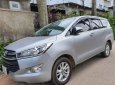 Toyota Innova 2016 - Cần bán lại xe Toyota Innova 2.0E sản xuất năm 2016, màu bạc xe gia đình