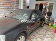 Ford Laser 2004 - Màu đen, 155 triệu