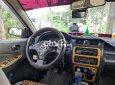 Mazda 323 1999 - Màu trắng, nhập khẩu