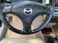 Mazda 323 2003 - Màu đen chính chủ, 120 triệu
