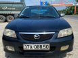 Mazda 323 2003 - Màu đen chính chủ, 120 triệu