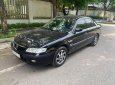 Mazda 626 2001 - Xe màu đen