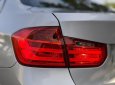 BMW 320i 2013 - Cần bán gấp BMW 320i sản xuất 2013, màu bạc, giá tốt
