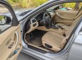 BMW 320i 2013 - Cần bán gấp BMW 320i sản xuất 2013, màu bạc, giá tốt
