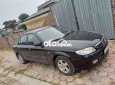 Mazda 323 Bán xe   màu đen, sx 2002. 2002 - Bán xe Mazda 323 màu đen, sx 2002.