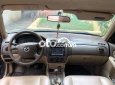 Mazda 323 .-2004 2004 - MAZDA.323-2004