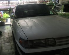 Mazda 323 1989 - Cần bán Mazda 323 đời 1989, màu trắng  giá 55 triệu tại Tp.HCM