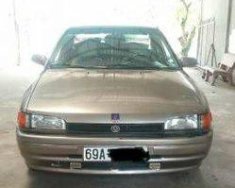 Mazda 323 1995 - Bán xe Mazda 323 đời 1995, màu vàng số sàn, 90 triệu giá 90 triệu tại Cà Mau