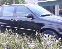 Kia Carnival 2007 - Cần bán Kia Carnival đăng ký 2007, màu đen còn mới, giá tốt 235tr giá 235 triệu tại Hải Dương