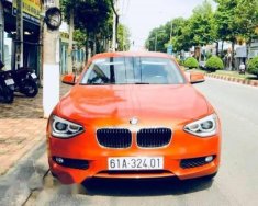 BMW 1 Series  116i  2014 - Chính chủ bán BMW 1 Series 116i đời 2014, màu cam giá 799 triệu tại Bình Dương