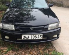 Mazda 323 MT 2000 - Bán Mazda 323 MT đời 2000, màu đen, xe nhập số sàn, 115 triệu giá 115 triệu tại Hải Dương