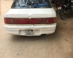 Mazda 323 1994 - Cần bán Mazda 323 đời 1994, màu trắng giá 60 triệu tại Hà Giang