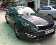 Kia Optima  AT 2011 - Cần bán xe Kia Optima AT 2011, màu đen, lăn bánh 2011 giá 585 triệu tại Tp.HCM