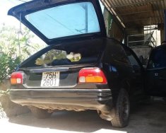 Mazda 323 1990 - Bán Mazda 323 1990, màu đen, xe đang đi lại bình thường giá 33 triệu tại Quảng Trị