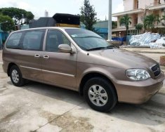 Kia Carnival GS 2009 - Cần bán xe Kia Carnival GS sản xuất 2009, màu vàng số tự động giá cạnh tranh giá 268 triệu tại Tiền Giang