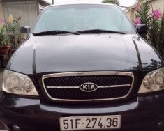 Kia Carnival   GS 2009 - Cần bán xe Kia Carnival GS năm 2009, màu đen số tự động, giá 325tr giá 325 triệu tại Tp.HCM