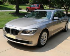 BMW 7 Series 750Li 2011 - Cần bán xe BMW 750Li 2011 màu vàng kim giá 1 tỷ 148 tr tại Tp.HCM