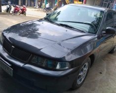 Mitsubishi Lancer GLXI 1.6 MT 2003 - Cần bán xe Mitsubishi Lancer GLXI 1.6 MT năm sản xuất 2003, màu đen xe gia đình, giá chỉ 135 triệu giá 135 triệu tại Sơn La