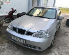 Daewoo Lacetti EX 1.6 MT 2005 - Bán xe Daewoo Lacetti EX Sx 2005, số tay, máy xăng, màu bạc, nội thất màu xám, odo 80000 km giá 165 triệu tại Long An