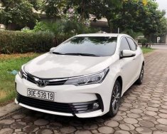 Toyota Corolla altis G 2017 - Bán xe Toyota Corolla altis G sản xuất 12/2017 phom 2018, màu trắng giá 720 triệu tại Hà Nội