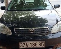 Toyota Corolla altis 2004 - Gia đình bán Toyota Corolla altis sản xuất năm 2004, màu đen giá 230 triệu tại Nghệ An