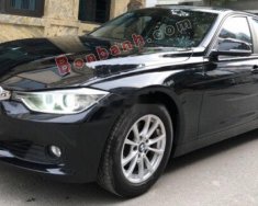 BMW 3 Series 320i 2012 - Cần bán xe BMW 320i sản xuất 2012, model 2013 màu đen giá 720 triệu tại Hà Nội